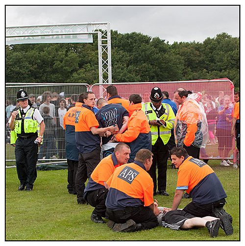 Security detain trouble makers at a festival